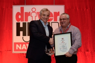 Driver Hire's CEO Chris Chidley (L) presents Richard Pugh (R) with an award at the Driver Hire 2016 Winter Conference.
